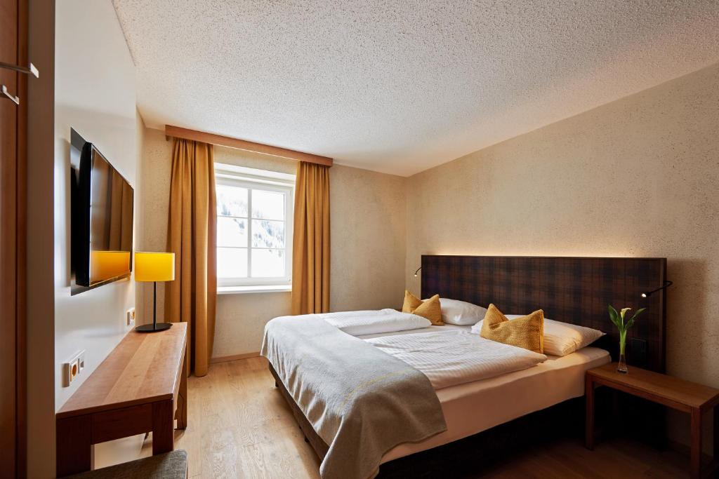 Postel nebo postele na pokoji v ubytování Après Post Hotel