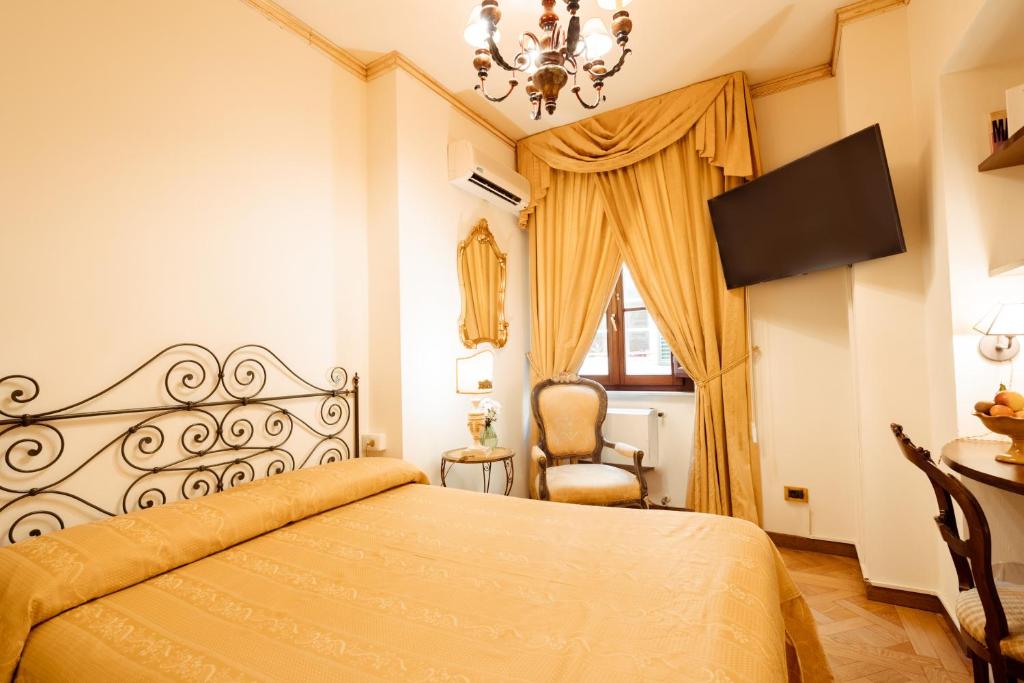 Postel nebo postele na pokoji v ubytování Hotel Palazzo Alexander
