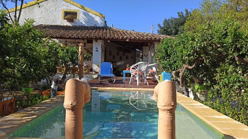 a swimming pool in front of a house at Zagara di Sicilia in Marsala