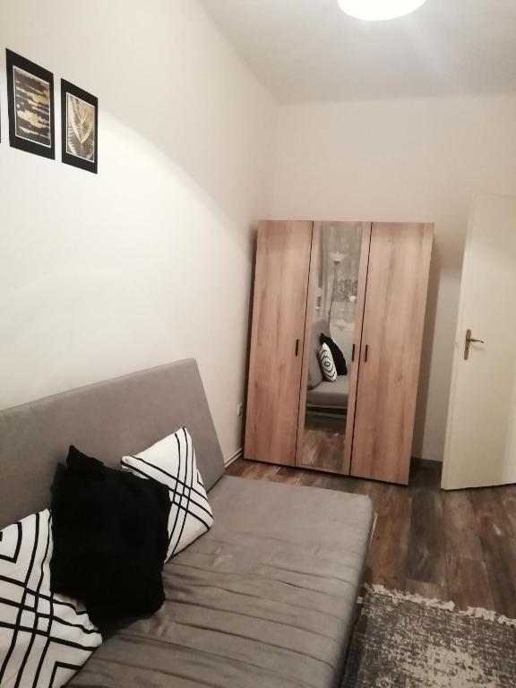 Posteľ alebo postele v izbe v ubytovaní Aréna Apartman