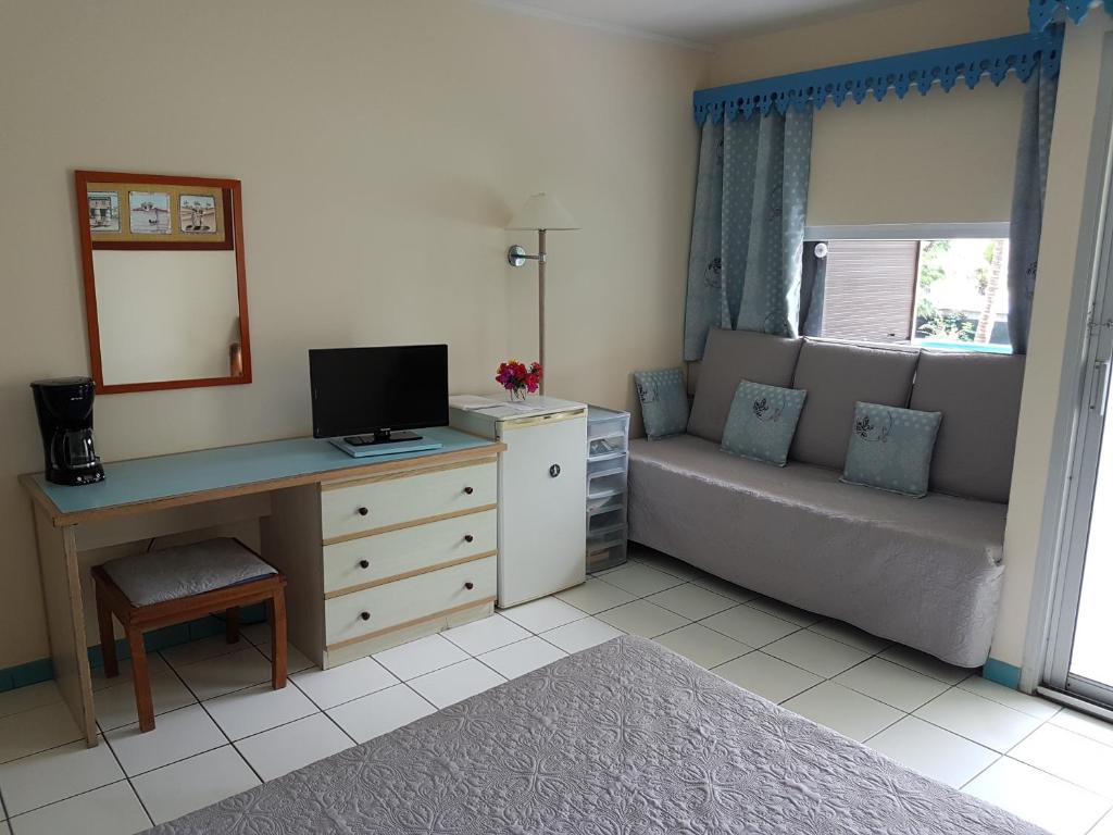 TV a/nebo společenská místnost v ubytování Studio CRISTAL COCO Martinique