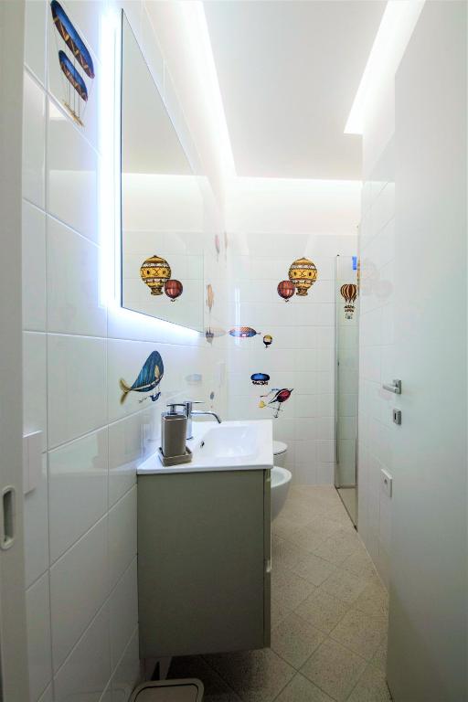 a bathroom with a sink and a toilet at Via Zug in Castiglioncello