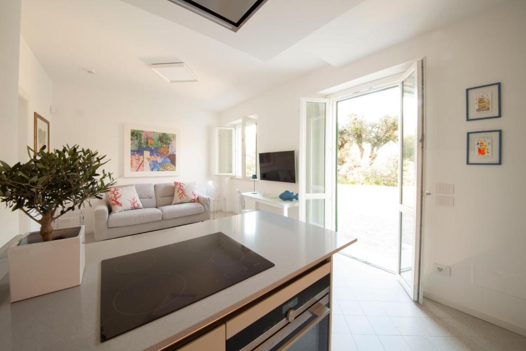 a living room with a couch and a table at Via Zug in Castiglioncello