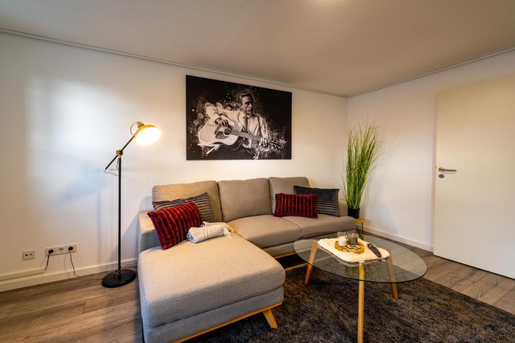 a living room with a couch and a table at Börde-Apartment 5 in Vahldorf