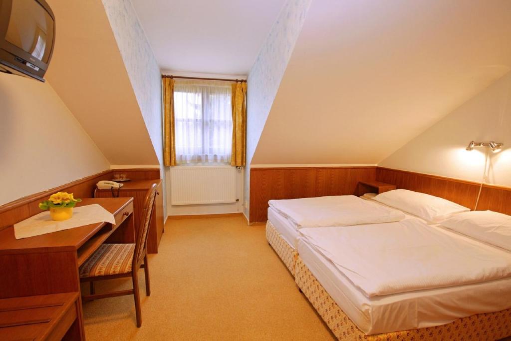 Posteľ alebo postele v izbe v ubytovaní Hotel Floret