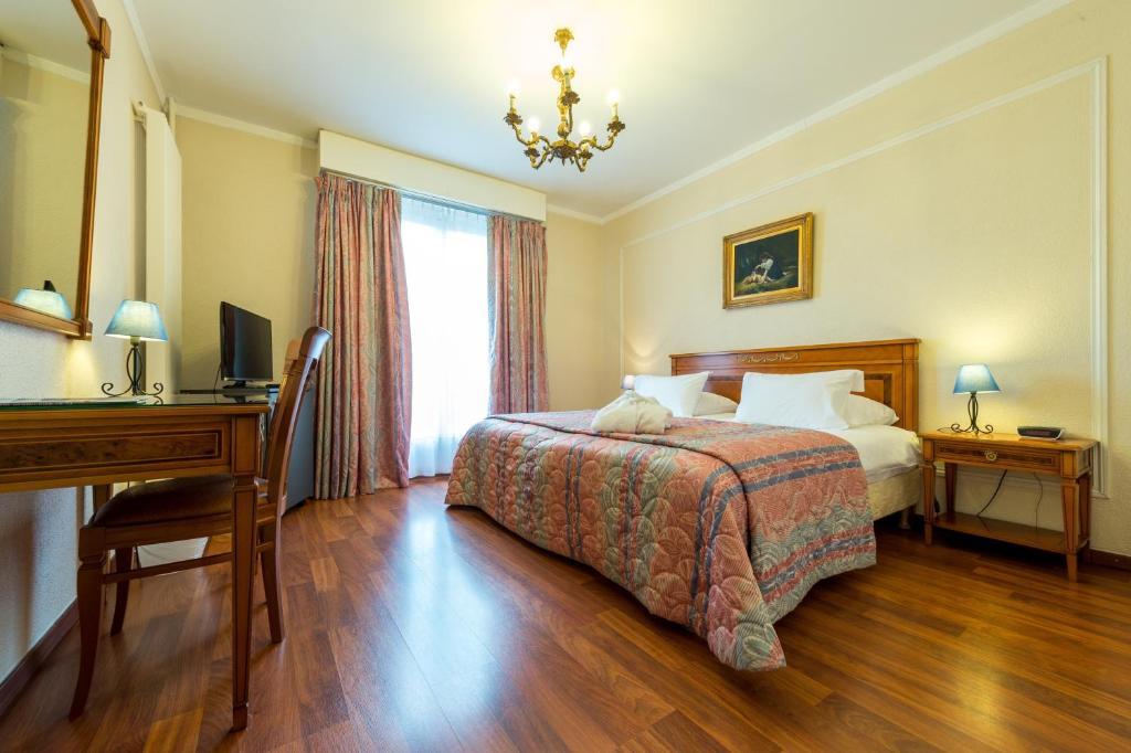 Postel nebo postele na pokoji v ubytování Hotel Diplomate