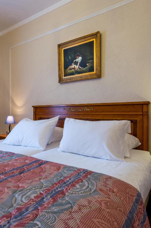 Postel nebo postele na pokoji v ubytování Hotel Diplomate