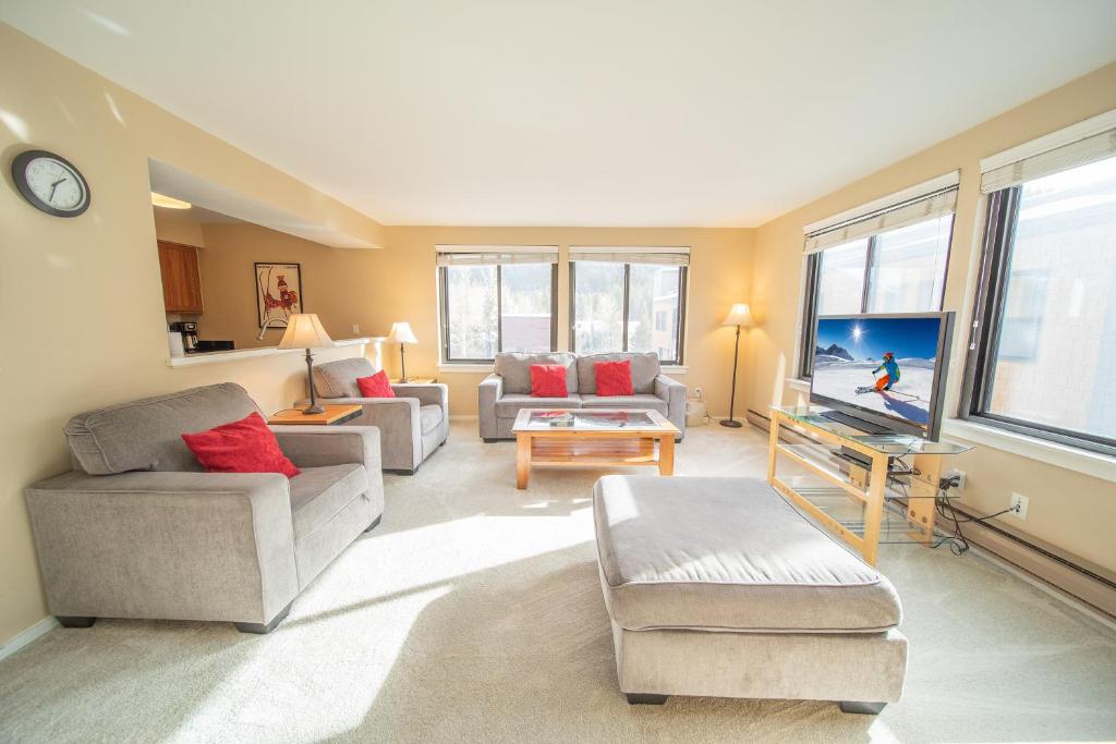 a living room filled with furniture and a large window at Edgewater 1444 in Keystone