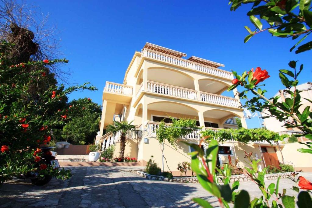 a large white building with a balcony at Two-Bedroom Apartment Crikvenica near Sea 6 in Dramalj