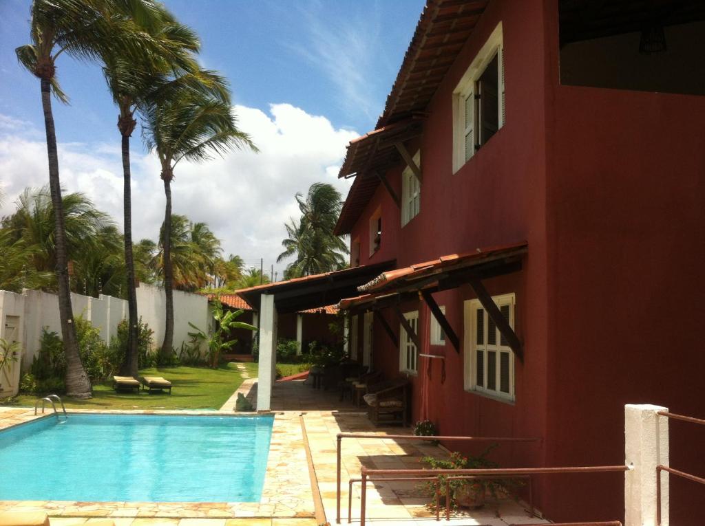 vistas laterales a la casa y a la piscina en Casa Cohiba, en Cumbuco