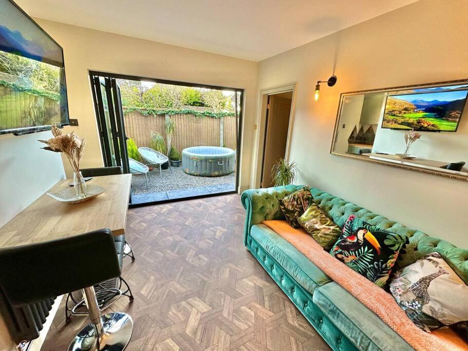 a living room with a couch and a table at Fortescue Lodge in Bournemouth