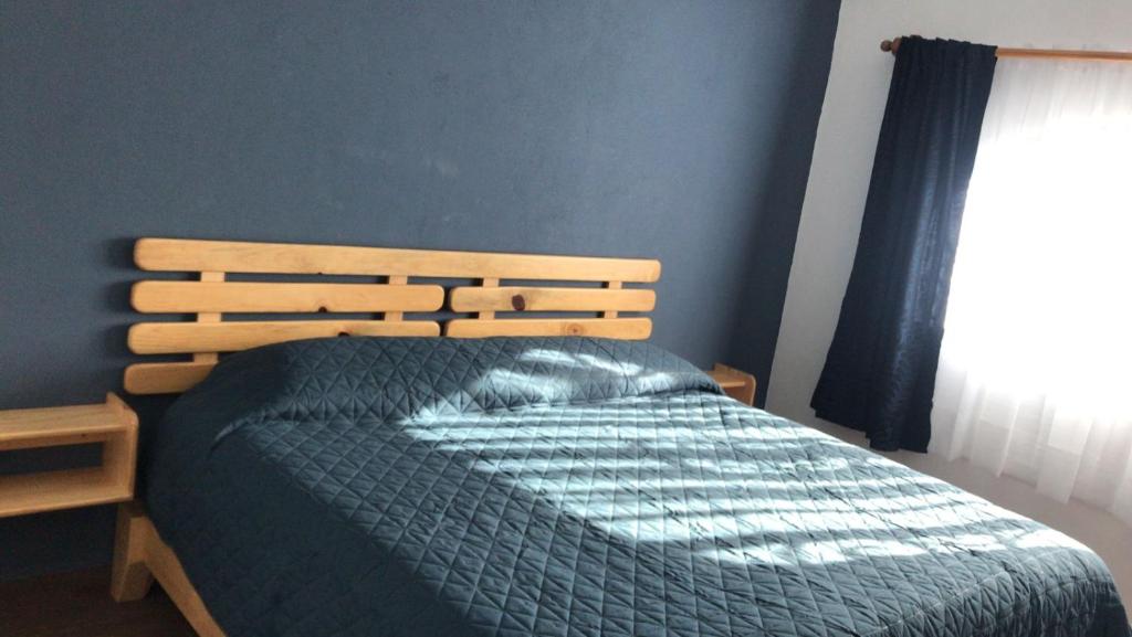 Postel nebo postele na pokoji v ubytování Hostal Casa Flor de Limón