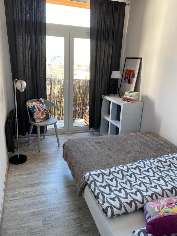 Posteľ alebo postele v izbe v ubytovaní Słoneczny apartament