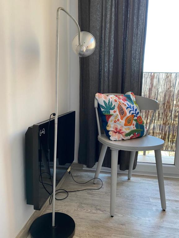 Televízia a/alebo spoločenská miestnosť v ubytovaní Słoneczny apartament
