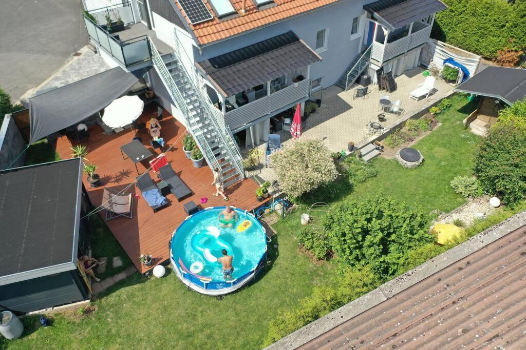 an overhead view of a backyard with a swimming pool at Kornhaus - schöne Ferienwohnung mit Pool, Kamin und Terrasse in Göttingen