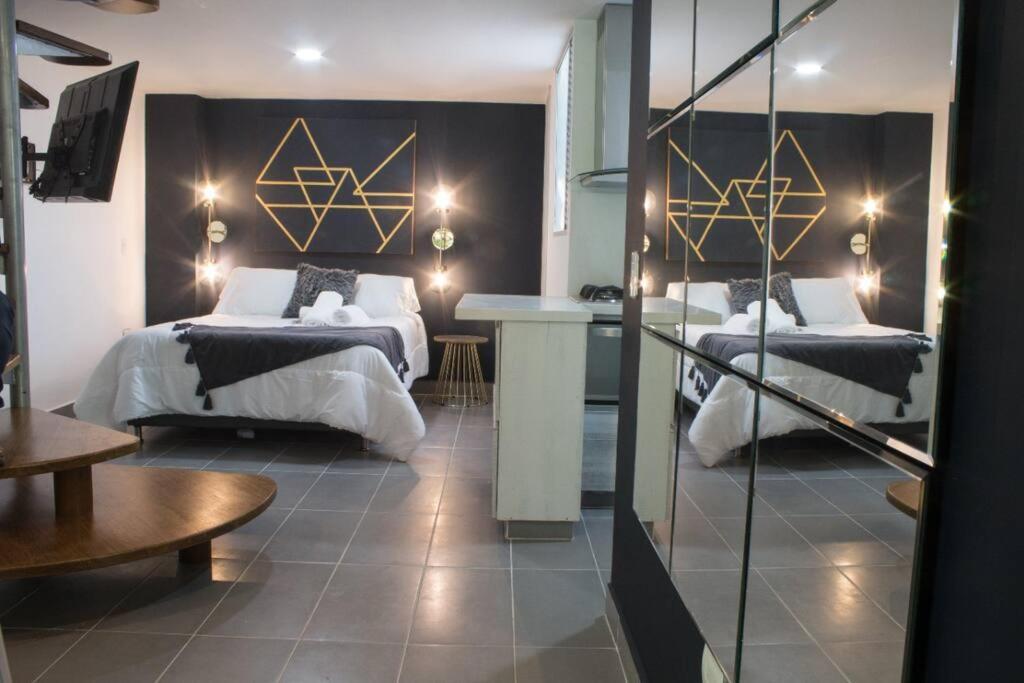 Ένα ή περισσότερα κρεβάτια σε δωμάτιο στο Espectacular apartamento Duplex VIP 501 con jacuzzy