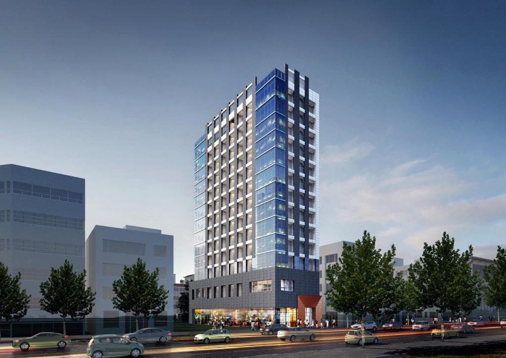 a tall building with cars parked in front of it at The Stay Classic Hotel Myeongdong in Seoul