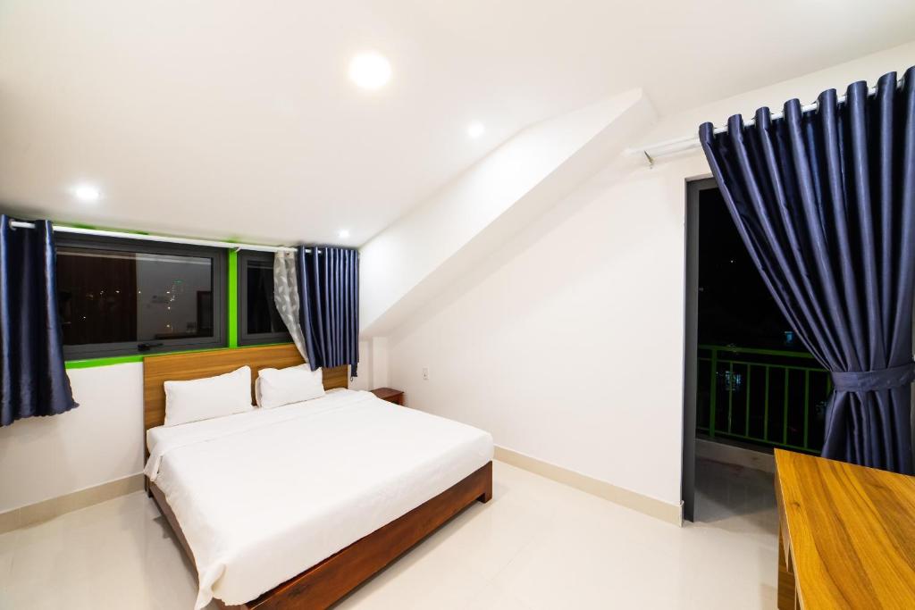 Giường trong phòng chung tại Đà Lạt Cao Nguyên Hotel