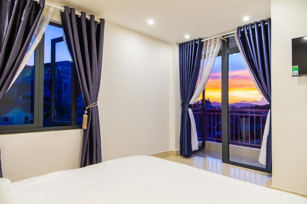Giường trong phòng chung tại Đà Lạt Cao Nguyên Hotel