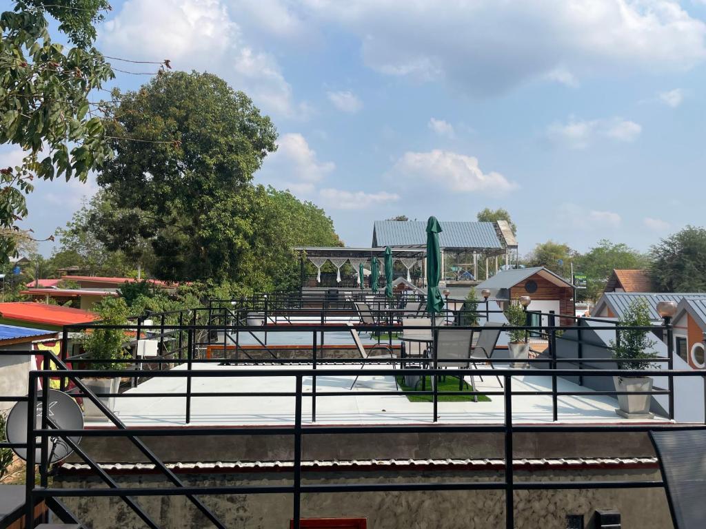 a playground with tables and chairs in a park at โมวิชญ์นาคาธิบดีรีสอร์ท in Ban Don Klang