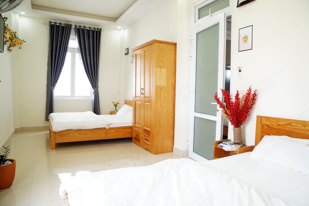 Giường trong phòng chung tại Môn Bạc Home