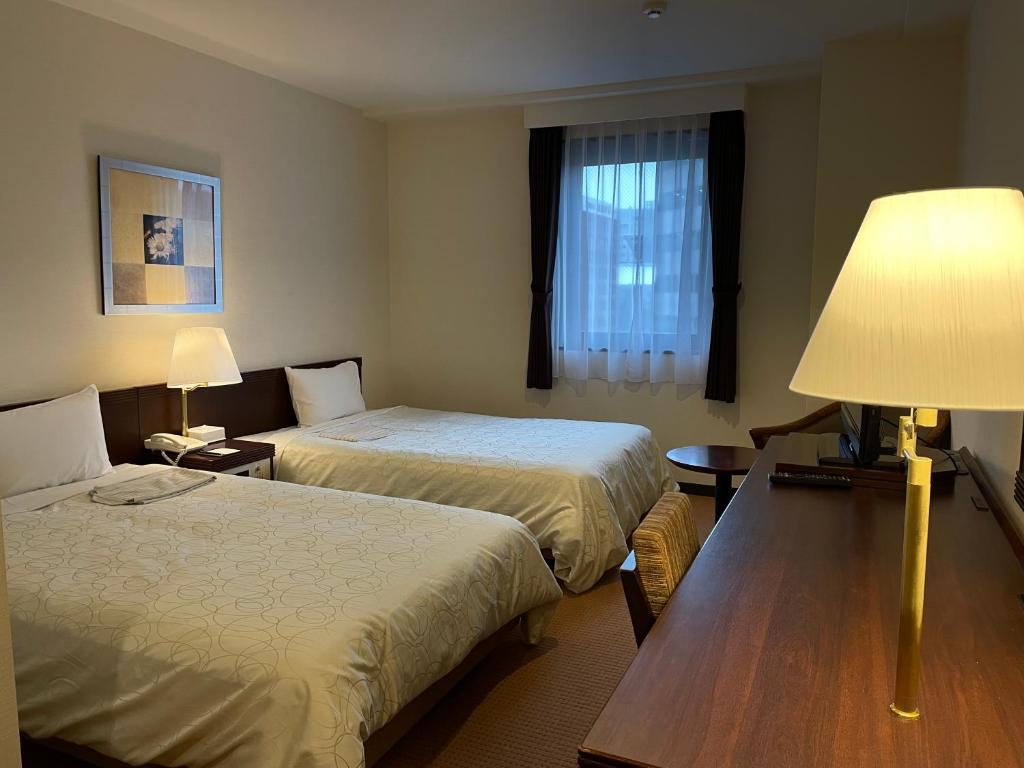 Postel nebo postele na pokoji v ubytování Hotel Courtland