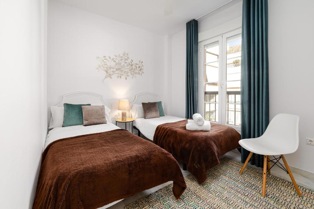 Postel nebo postele na pokoji v ubytování Marbella playa Residencial con piscina