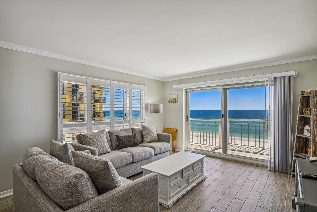 a living room with a couch and a view of the ocean at Destin Towers Condo 61 Condo in Destin