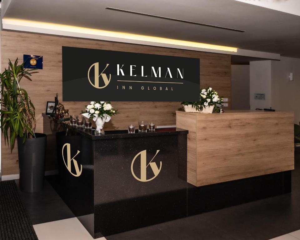 a sign for a law firm office with a reception desk at Kelman Inn Global Nowa Sól in Nowa Sól