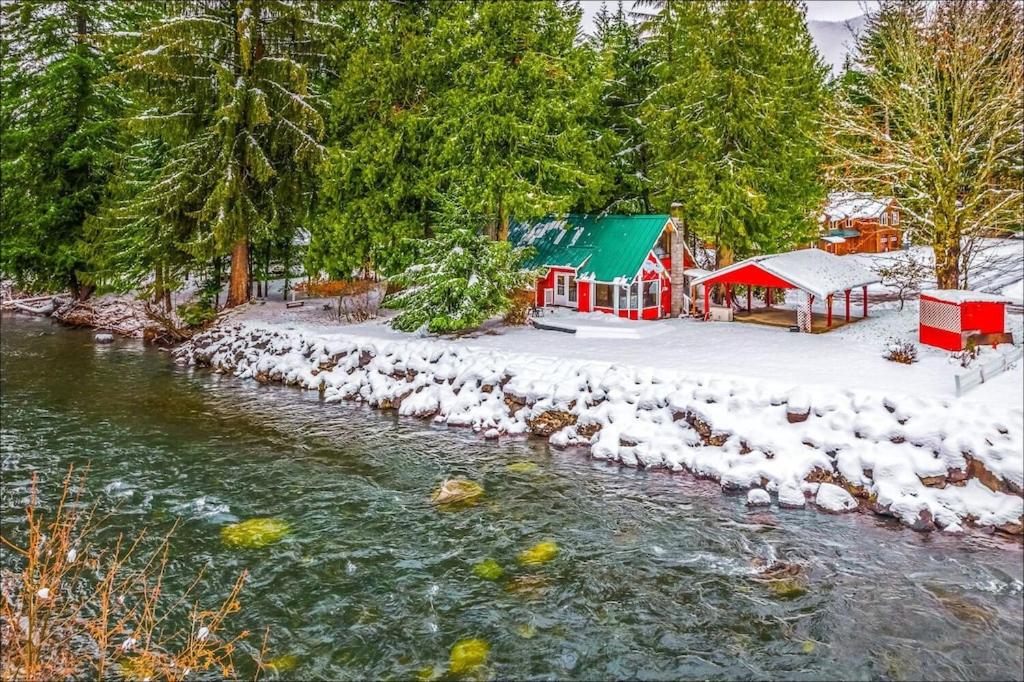 a small playground next to a river with snow at NEW: Steps from White River near Mount Rainier National Park in Greenwater