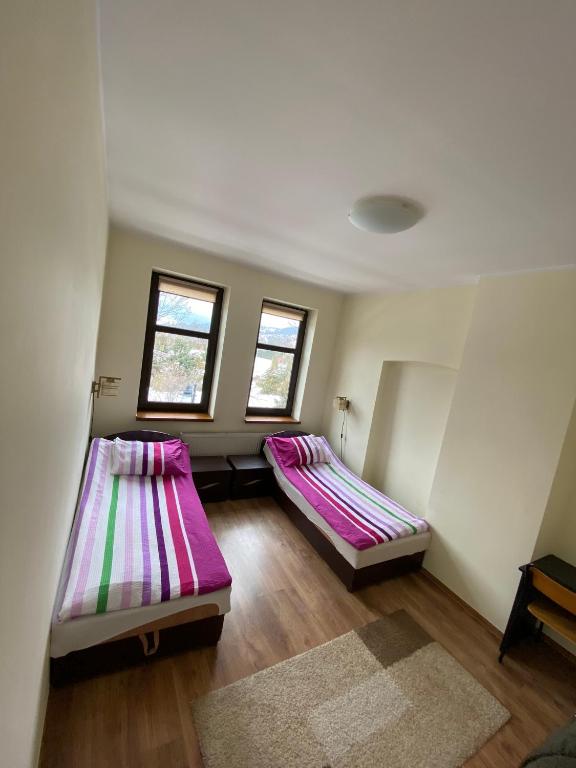 Posteľ alebo postele v izbe v ubytovaní Apartament Polański z tarasem na dachu