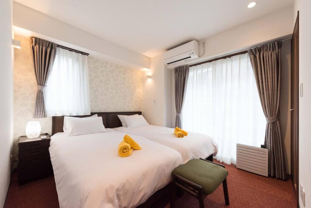 Ένα ή περισσότερα κρεβάτια σε δωμάτιο στο Serorin Light Hotel Tokyo