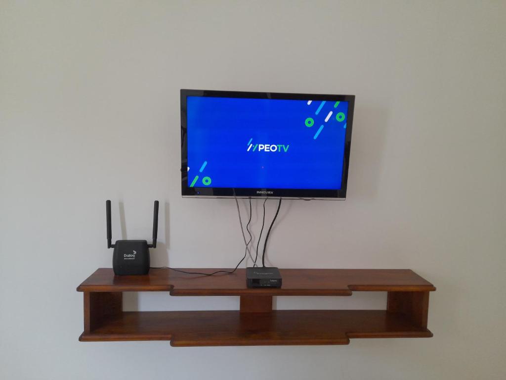 TV a/nebo společenská místnost v ubytování Gloria Inn