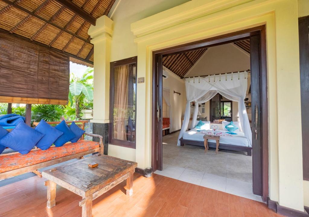 Postel nebo postele na pokoji v ubytování Amertha Bali Villas