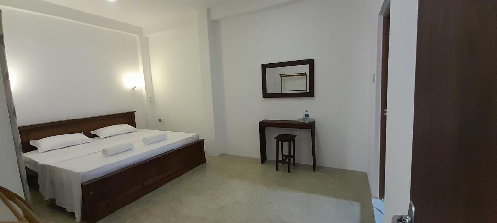 Postel nebo postele na pokoji v ubytování Gloria Inn
