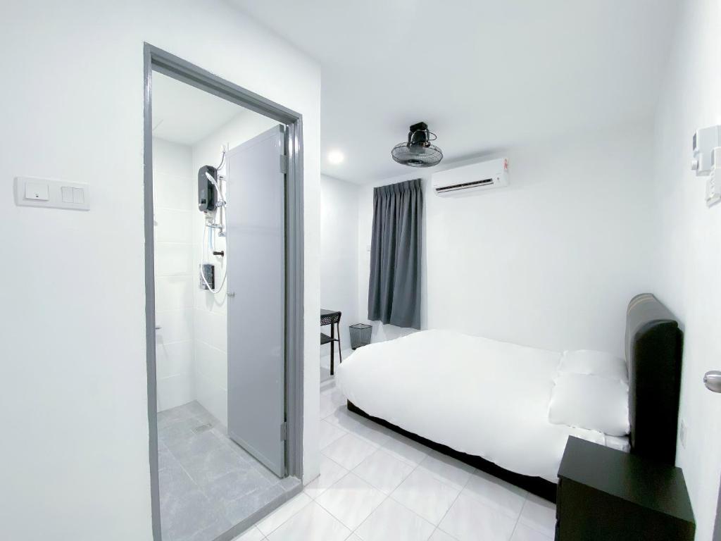 Voodi või voodid majutusasutuse Venice Guest Hostel - Bilik Sahaja toas