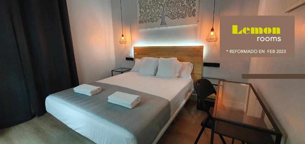 Cama o camas de una habitación en CH Lemon Rooms - Madrid