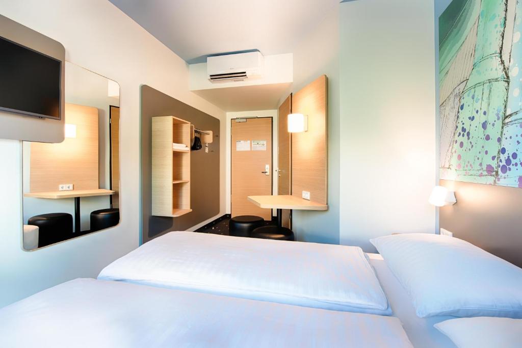 Postel nebo postele na pokoji v ubytování B&B Hotel Chemnitz