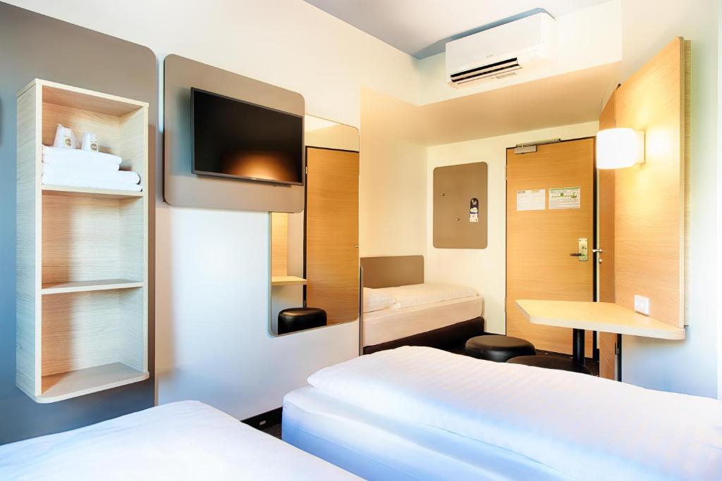 Postel nebo postele na pokoji v ubytování B&B Hotel Chemnitz
