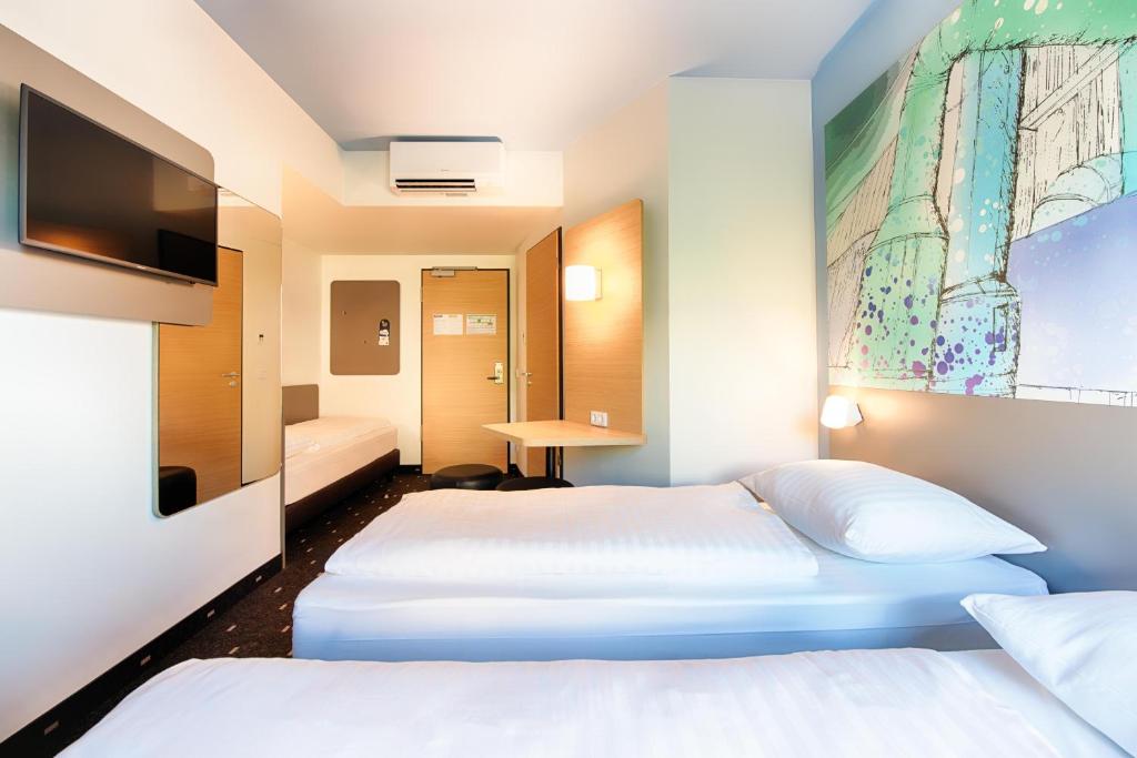 Postel nebo postele na pokoji v ubytování B&B Hotel Chemnitz