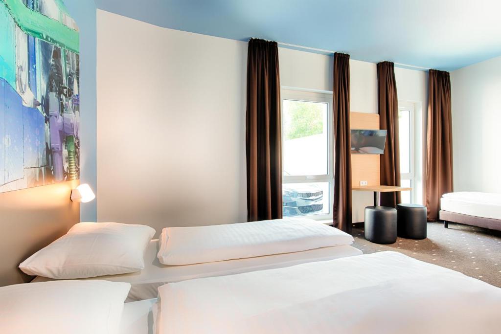 Postel nebo postele na pokoji v ubytování B&B Hotel Chemnitz