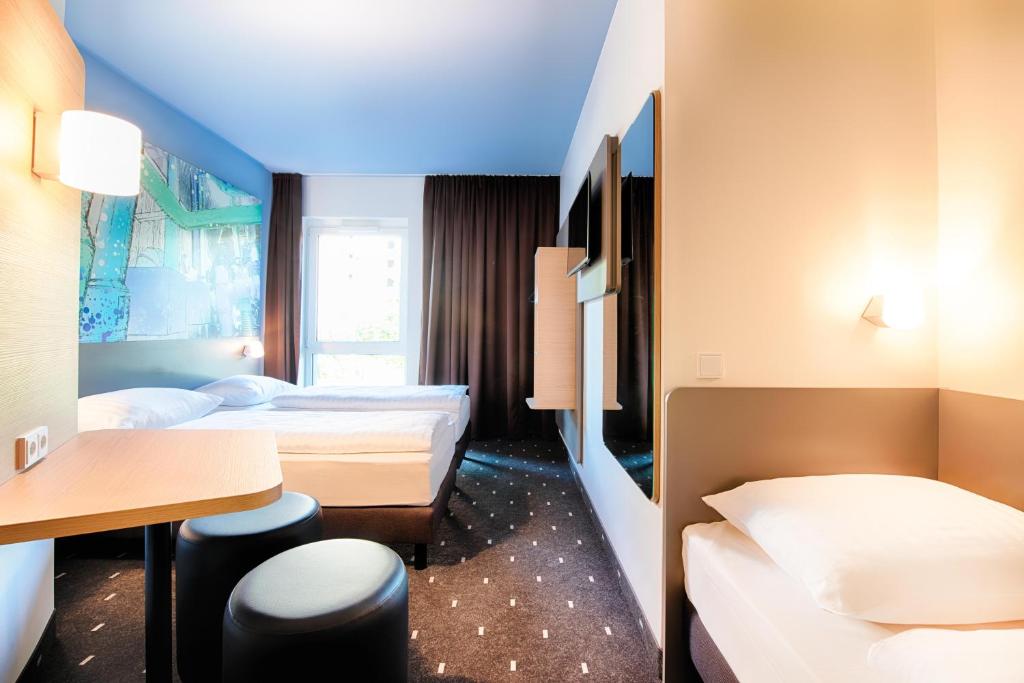 Postel nebo postele na pokoji v ubytování B&B Hotel Chemnitz