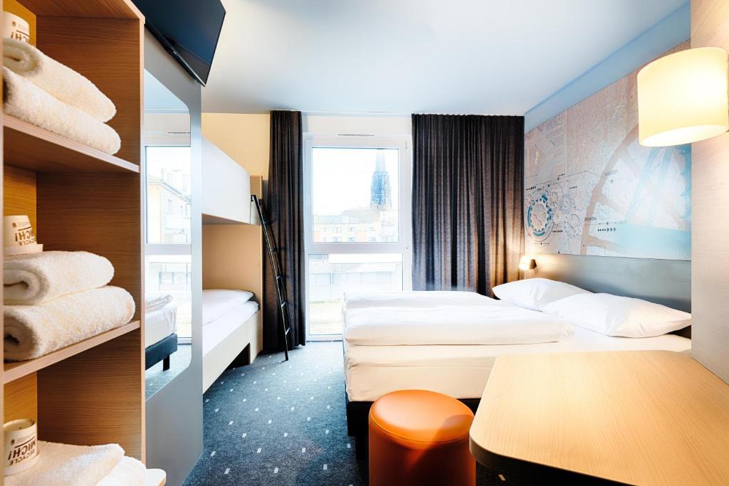 Postel nebo postele na pokoji v ubytování B&B Hotel Bochum-City