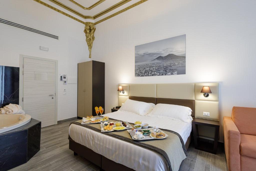 Postel nebo postele na pokoji v ubytování Hotel Palazzo Argenta
