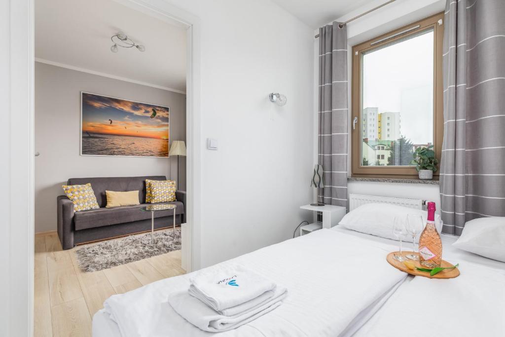 Postel nebo postele na pokoji v ubytování Wind Rose Quarter Apartments by Noclegi Renters