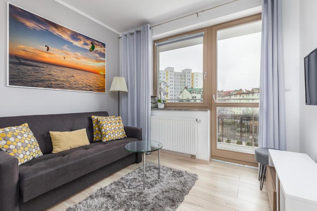 Posezení v ubytování Wind Rose Quarter Apartments by Noclegi Renters