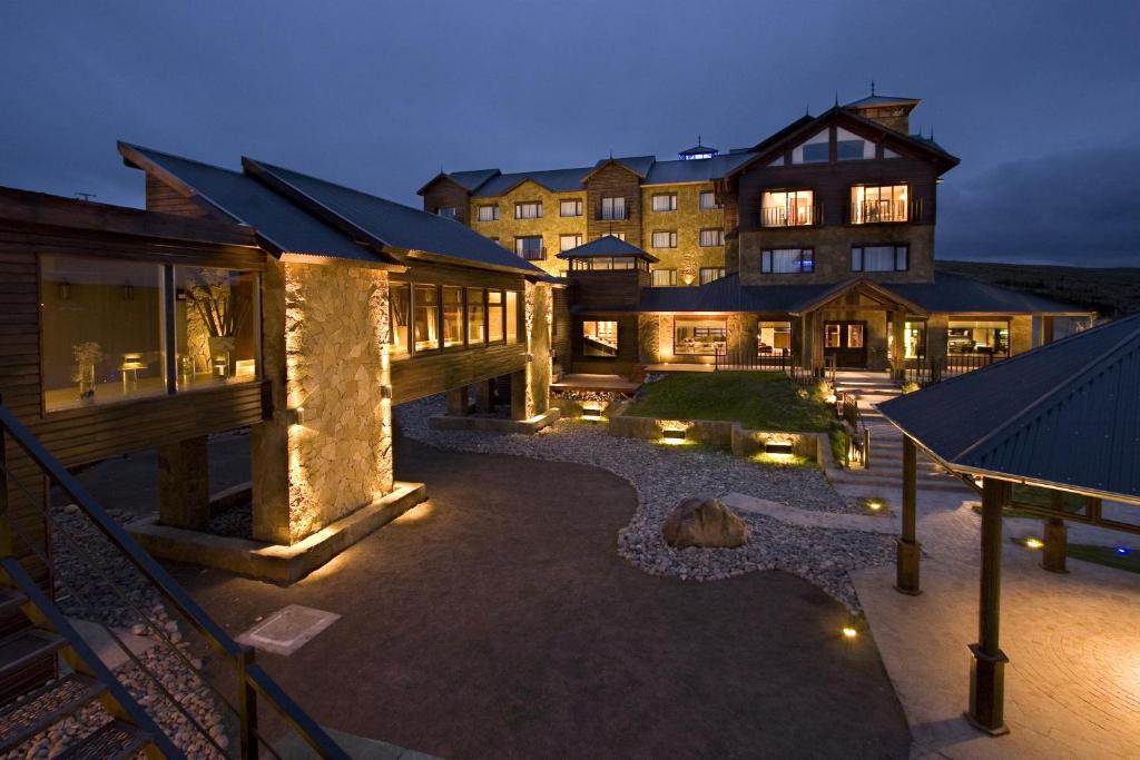 a large building with lights in front of it at Imago Hotel & Spa in El Calafate