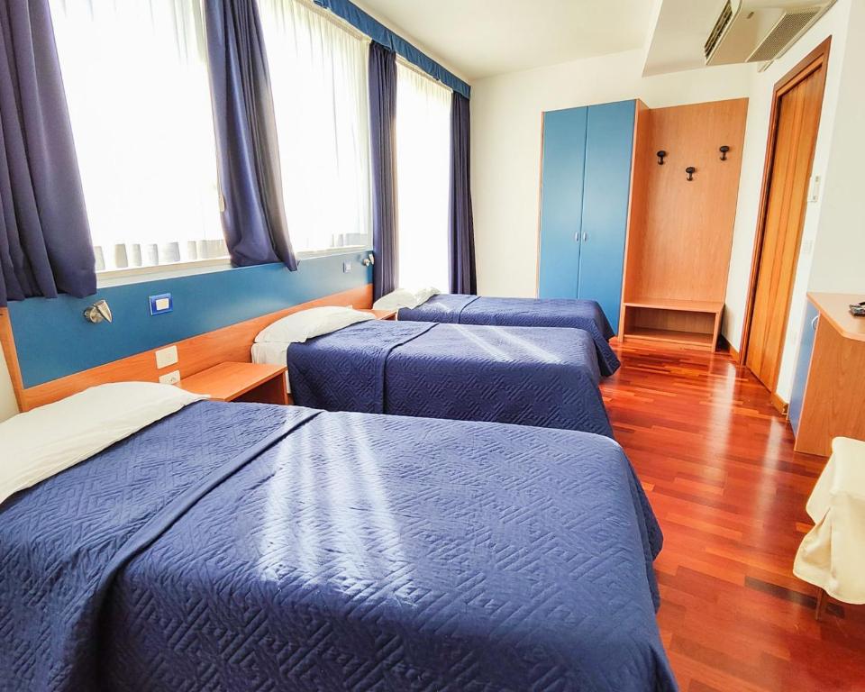 Postel nebo postele na pokoji v ubytování Hotel all'Oasi
