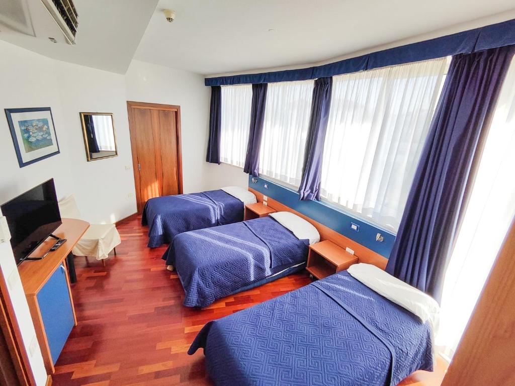 TV a/nebo společenská místnost v ubytování Hotel all'Oasi