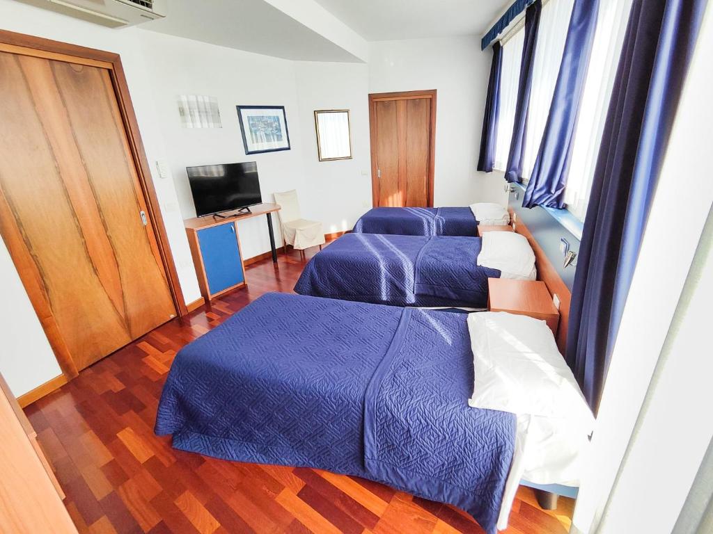 Postel nebo postele na pokoji v ubytování Hotel all'Oasi
